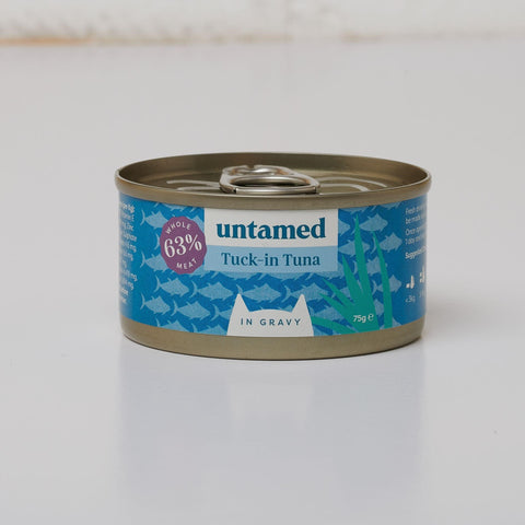 A close-up shot of a teal can of Untamed Tuck-in Tuna in gravy