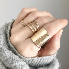 A hand modeling the Katye Landry gold cuff ring