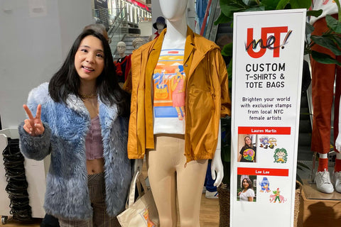Loe standing in Uniqlo next to a mannequin that's wearing the Tshirt she designed