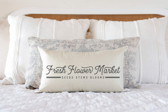 Fresh Flower Market Decorative Pillow Cover 12x20 inches displayed on bed
