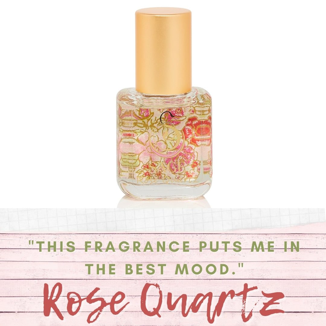 image of rose quartz glass extract bottle with words “ This fragrance puts me in the best mood”