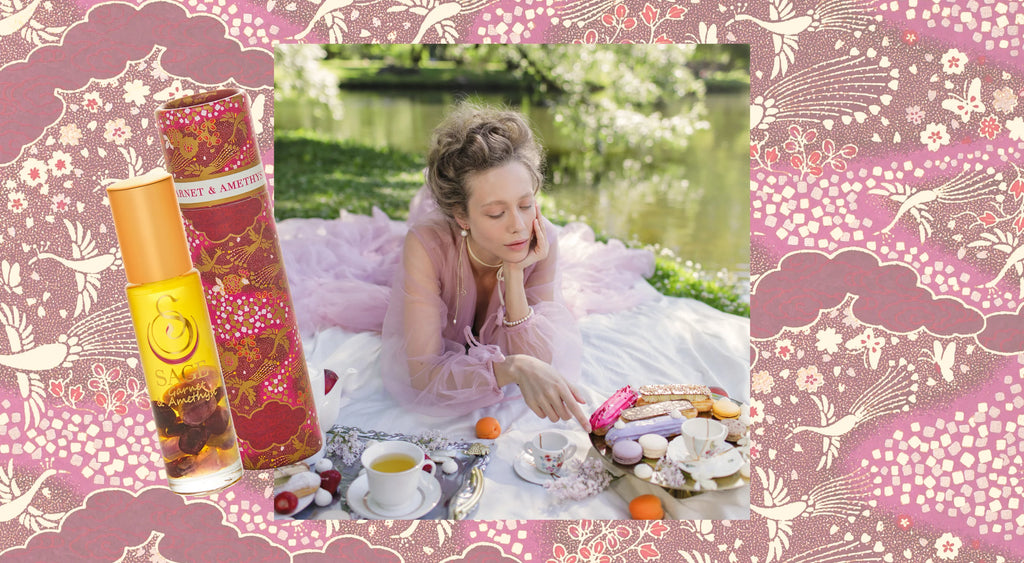 image of garnet amethyst blend infront of women in puffy dress having a tea party near a pond