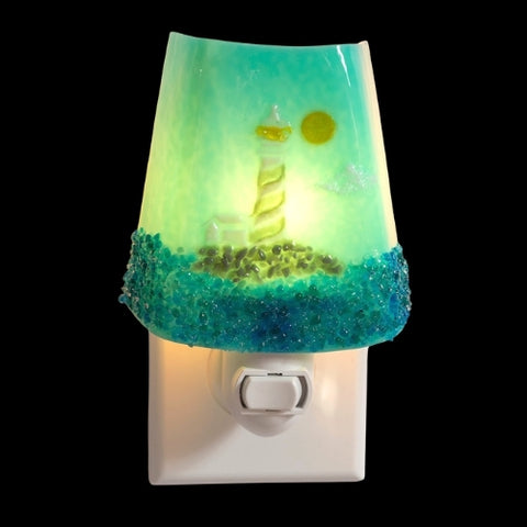 Lighthouse nightlight in the ocean with sun and green, blue, and yellow