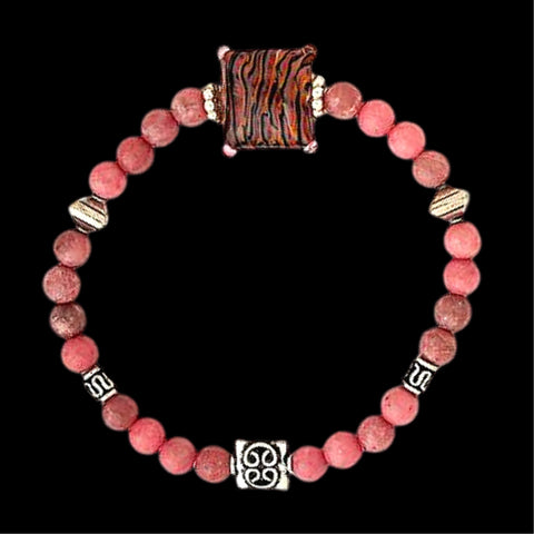 Serenity Gemstone Bracelet hand-sculpted glass bead enhanced with sterling silver beads and rhodonite gemstones on a stretchy nylon cord