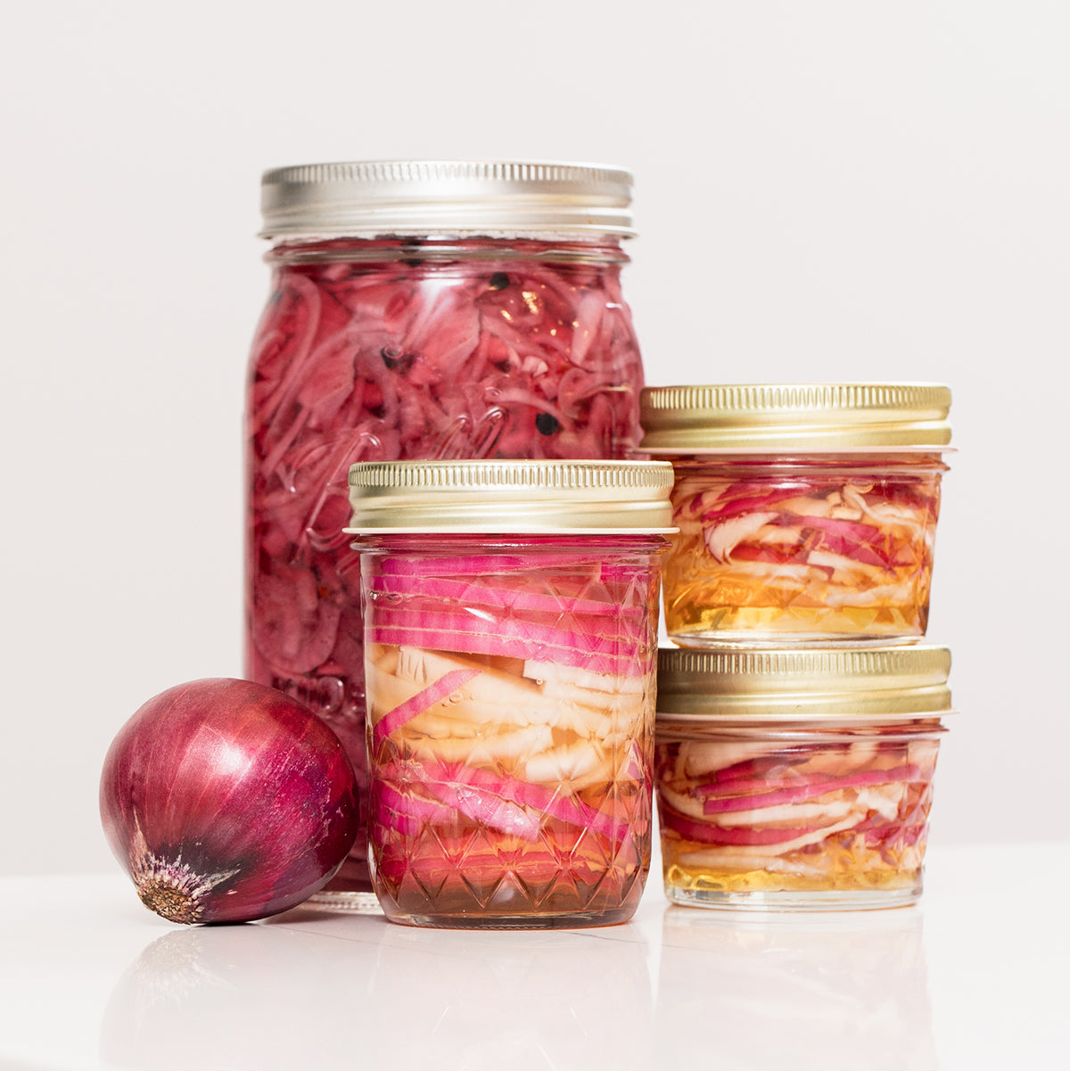 https://cdn.shopify.com/s/files/1/0436/2341/5960/t/11/assets/45786fc89067--BHill-Mint-Shrub-Pickled-Onions-05.jpg?v=1681775252