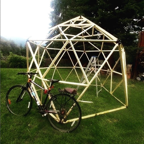 A fully braced magidome geodesic dome greenhouse before covering