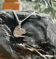 https://calithien.com/collections/storybook-collection/products/i-am-fire-sleeping-silver-dragon-pendant