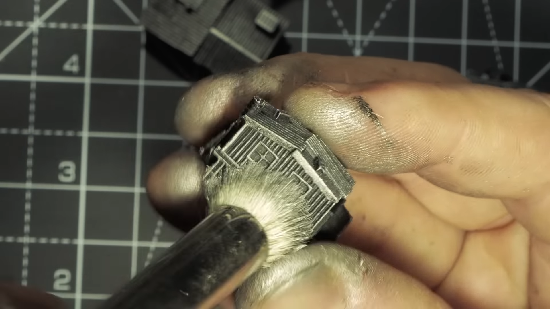 Silver dry brush to create metal effects on the miniature models
