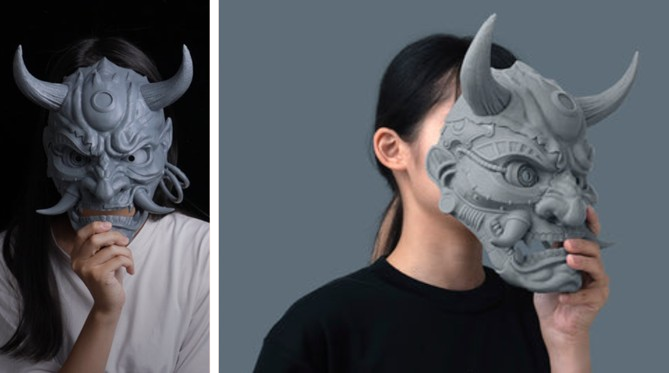 a girl holding a 3d printed oni mask in front of her face.