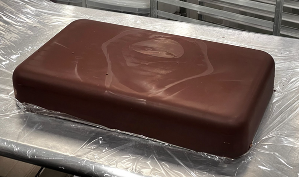 large slab of chocolate on a metal table
