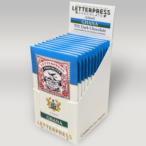 a white case of letterpress chocolate bars