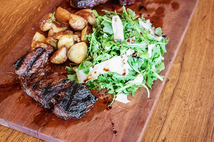 steak with salad and potatoes