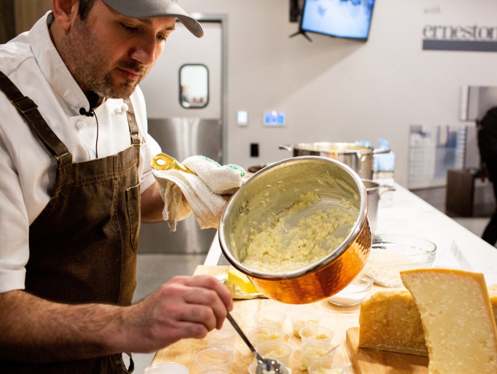 cooking school chef serving risotto