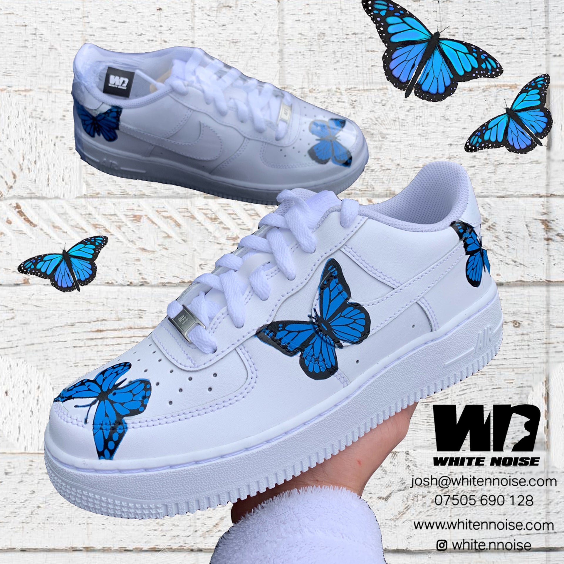 white nike with butterflies