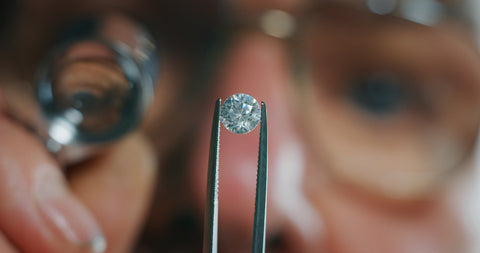 gemologist examines lab diamond