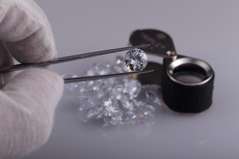 examining diamond gems