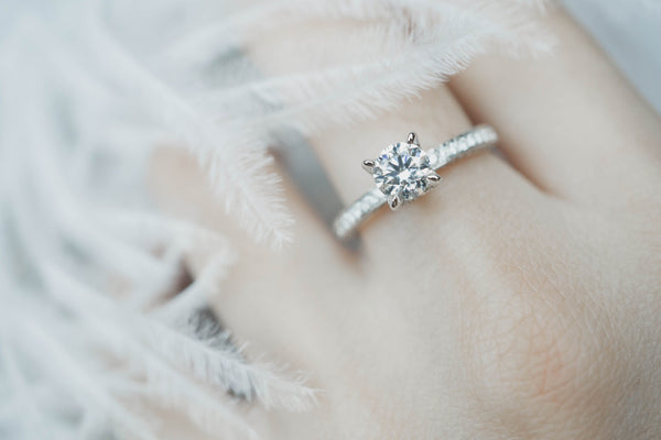 diamond engagement ring on finger