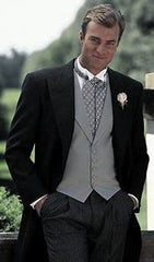 Groom wearing a morning suit with ascot