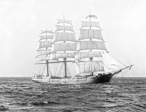 A vintage photograph of a clipper ship on the sea