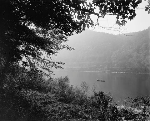 A black and white, vintage image of a canoe on the Delware River