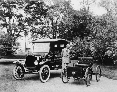 Henry Ford with the first and 10 millionth ford vehicles