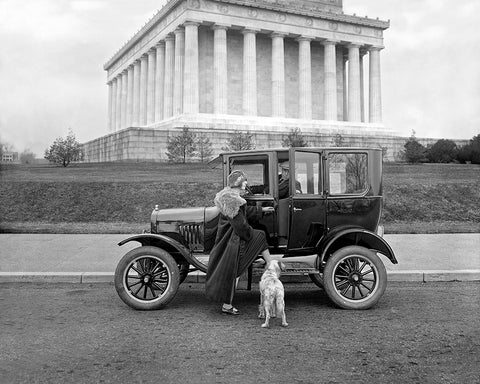 Photograph of vintage Ford at the Lincoln Memorial with woman and dog
