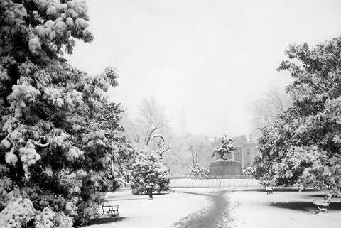 A black and white photograph of Lafayette Park covered in snow