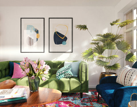 Two Framed Prints Above a Green Couch