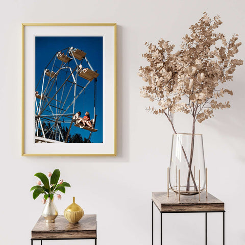 A framed print of a vintage photograph of a Ferris Wheel at the Vermont State Fair