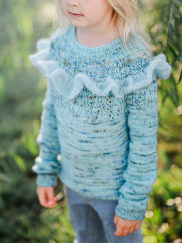 full view of effervescent mini sweater including optional ruffle.