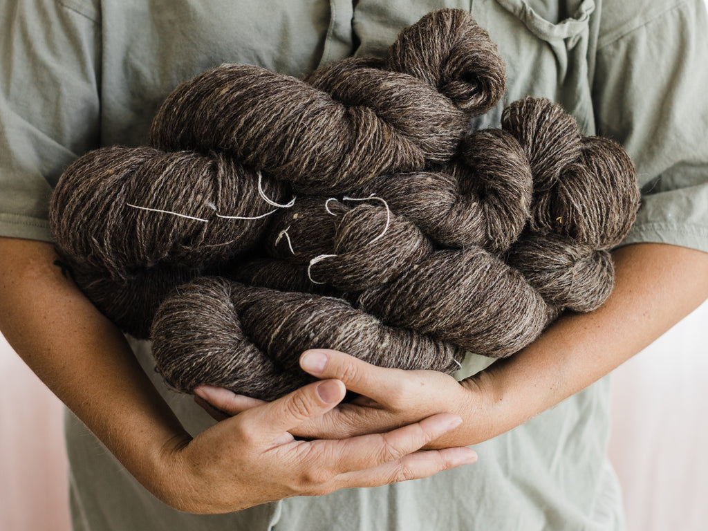 this darling home skeins of brown/grey handspun wool yarn. It was spun for a commission and is destined to be woven into a scarf