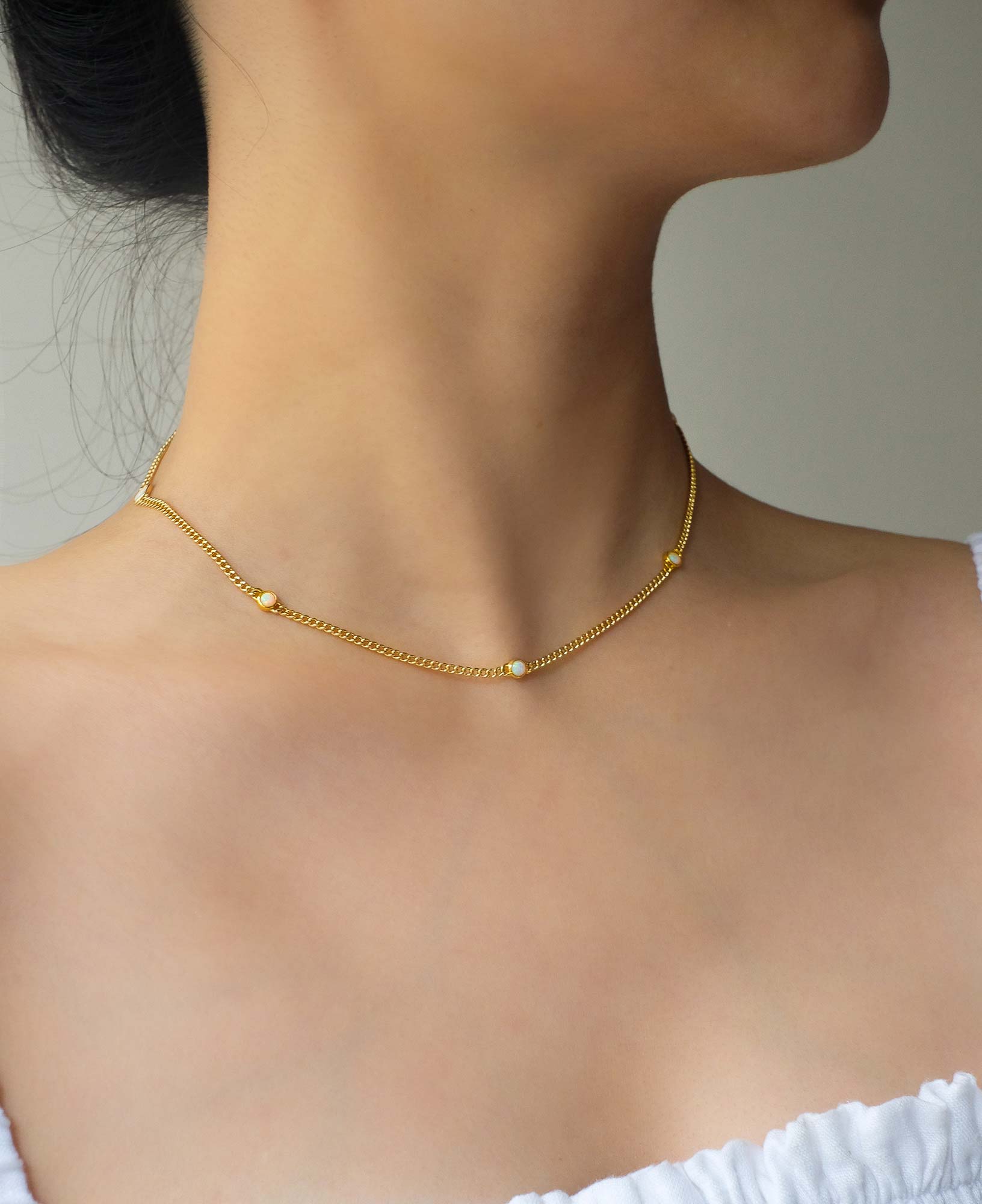 lifestyle shot of wearing Thea Opal Gold Necklace