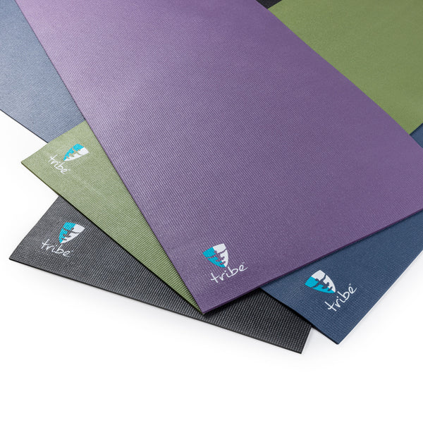 TRIBE ReGen 5mm Yoga Mats lying on top of each other - Purple Sage, Sage, Vintage Indigo, Cosmos | TRIBE Yoga