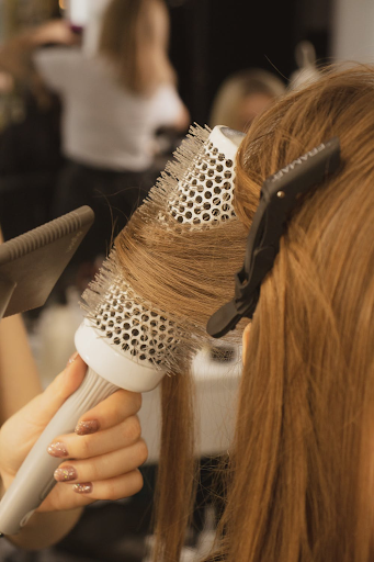 Picture of hair being blow dried with a round brush head