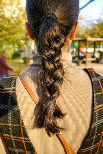 Image of basic braid style on a woman with long brown hair