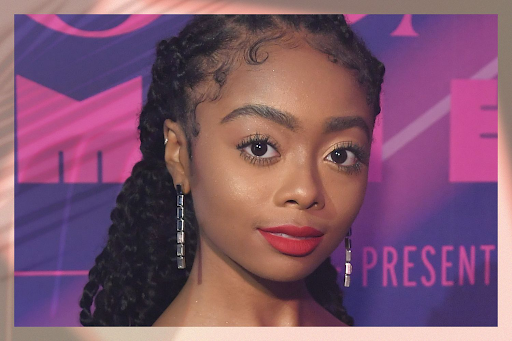 Image of a female with passion twists posing wearing red lipstick.