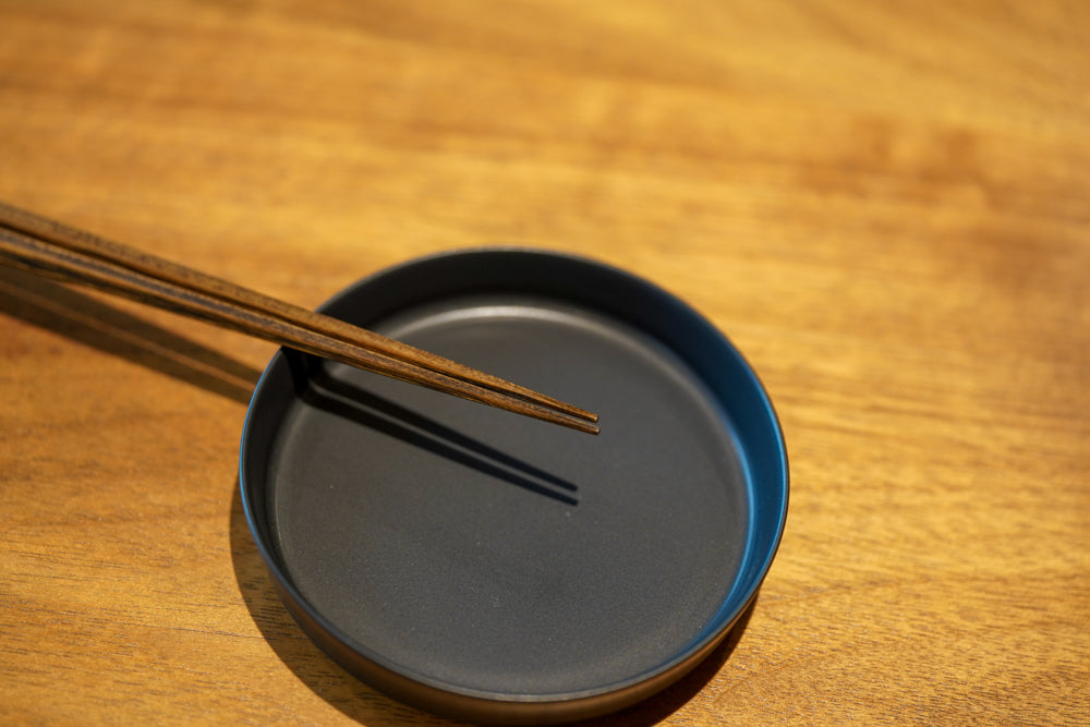 chopsticks resting on a plate