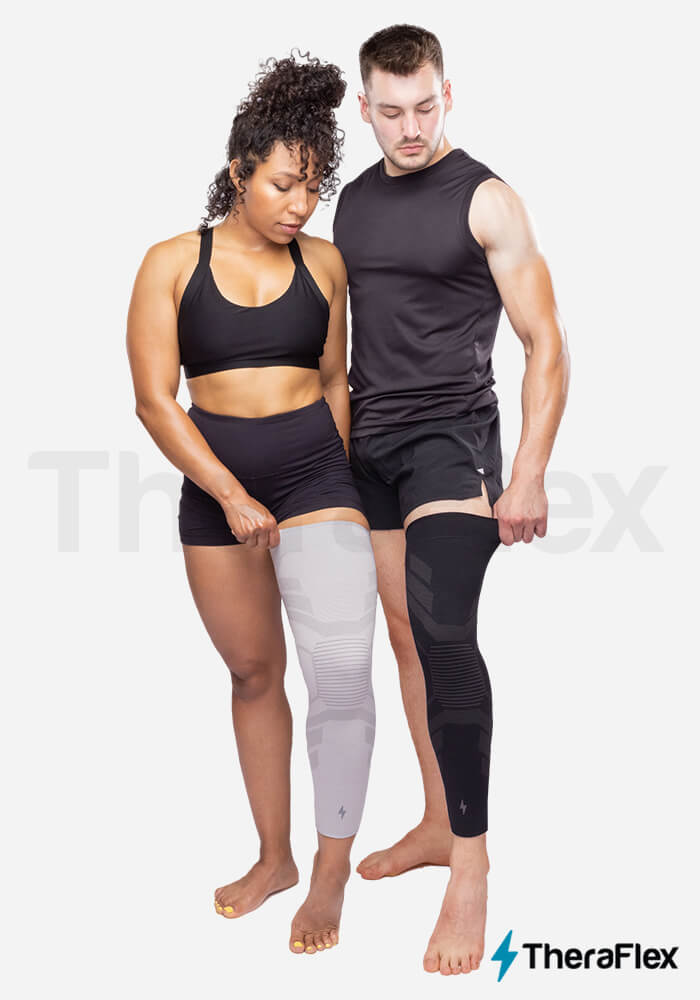 Young man modeling TheraFlex Knee Sleeve.