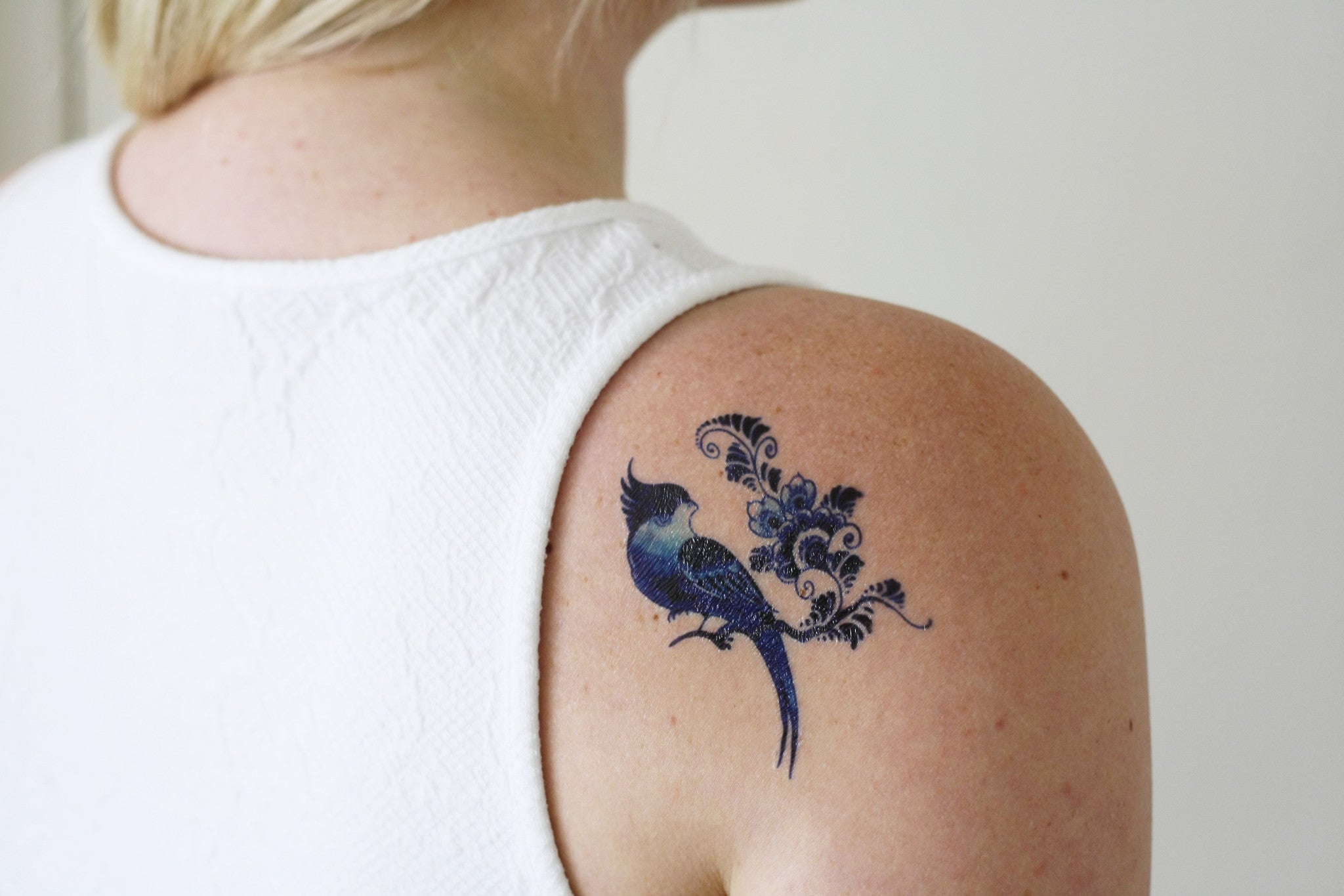 Delfts Blue bird and flower tattoo - Tattoorary