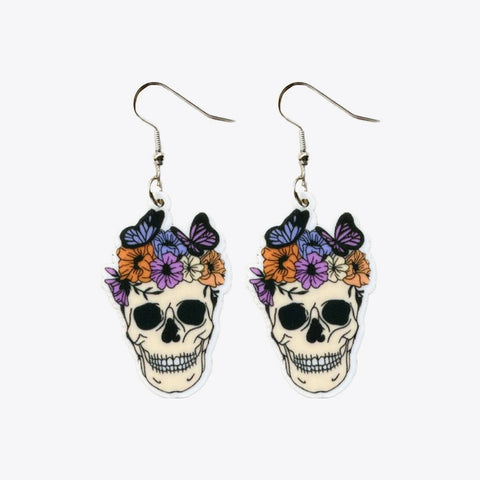 Day of the Dead-inspired earrings with ornate sugar skull charms
