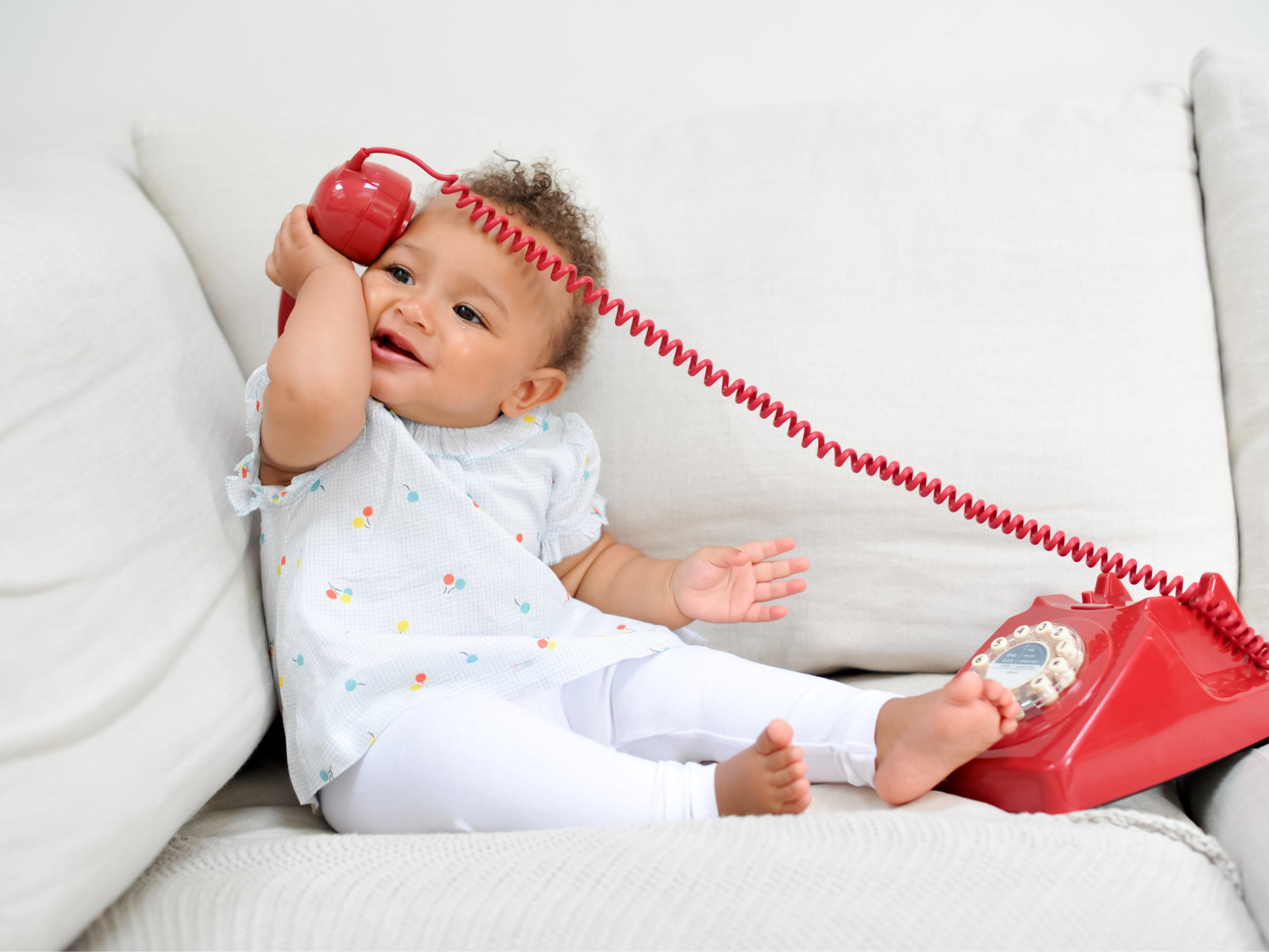 Baby on Telephone Communication Finding Support 