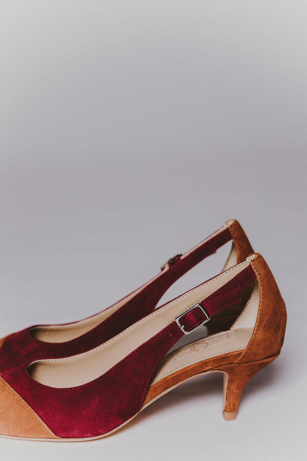 Brown and burgundy suede leather kitten heel.