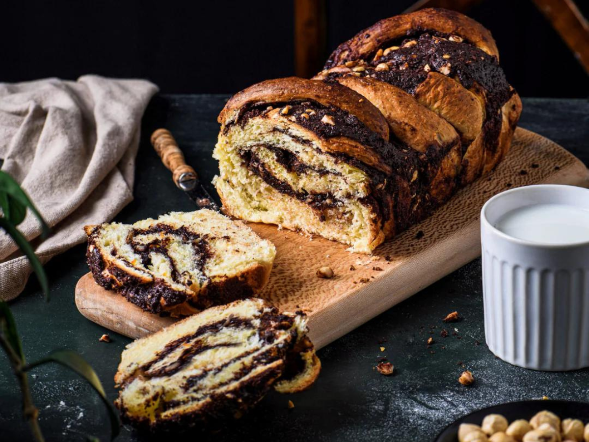 Chocolate Hazelnut Babka Against A Wooden Surface