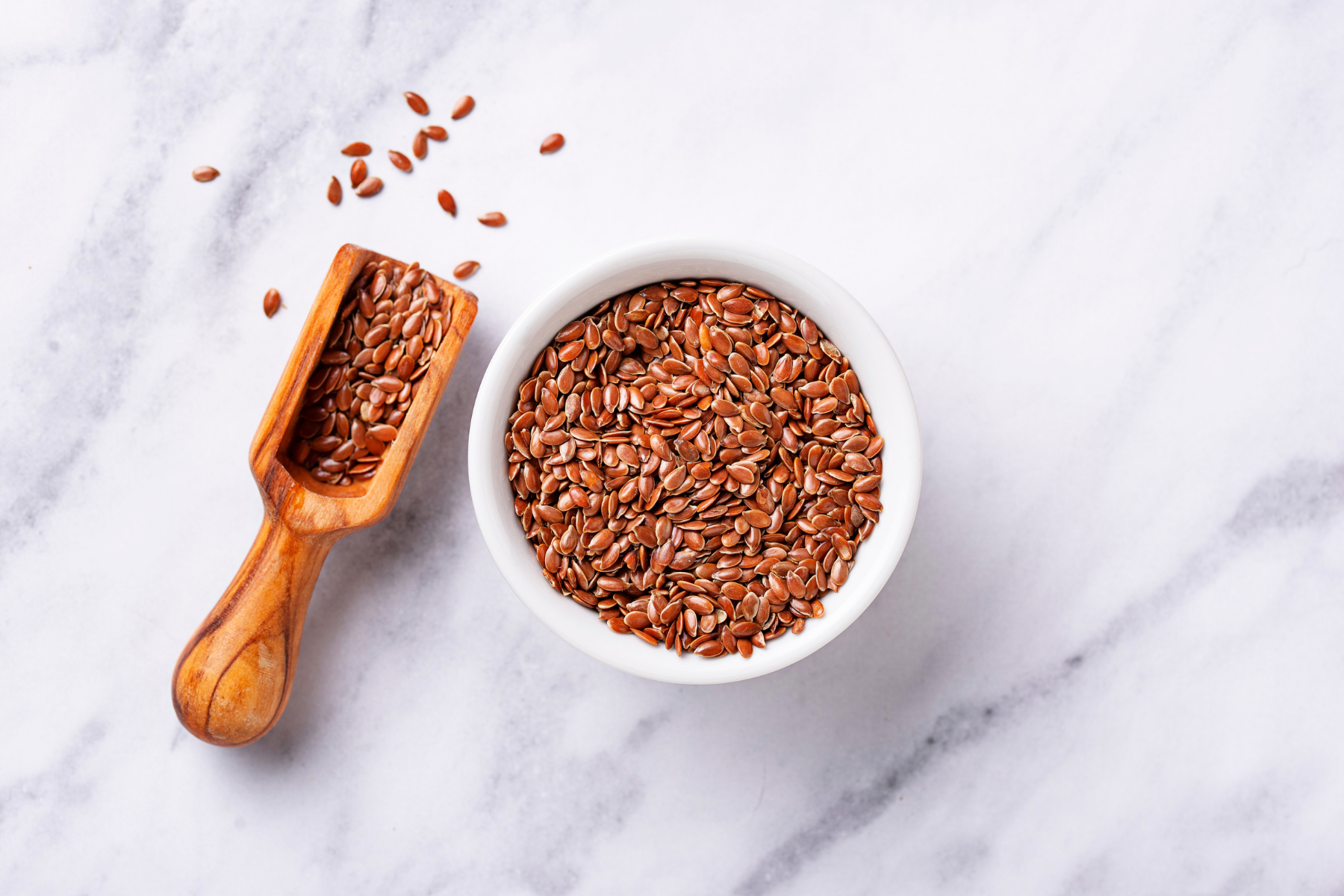 A bowl of flax seeds known to be high in phytoestrogens, which can help relieve menopausal symptoms.