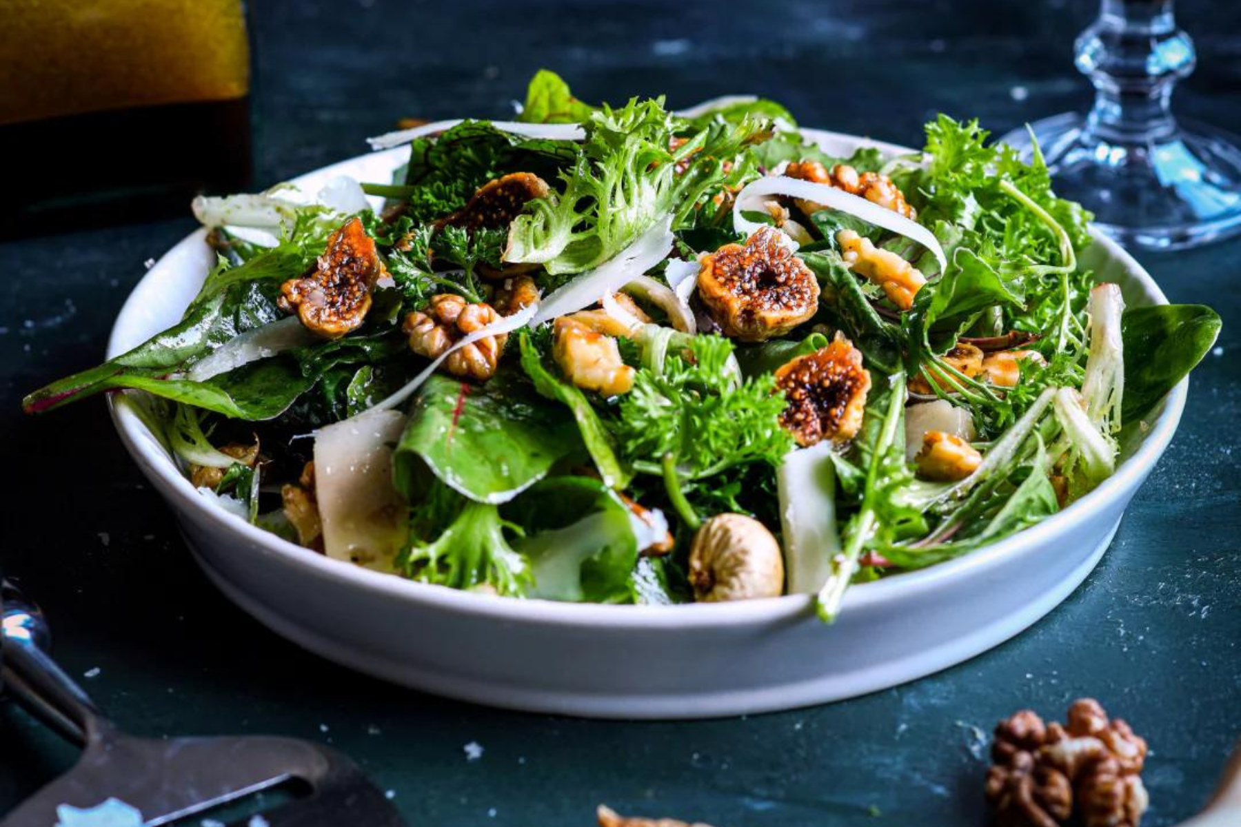 A bowl of fig, walnut and parmesan salad.