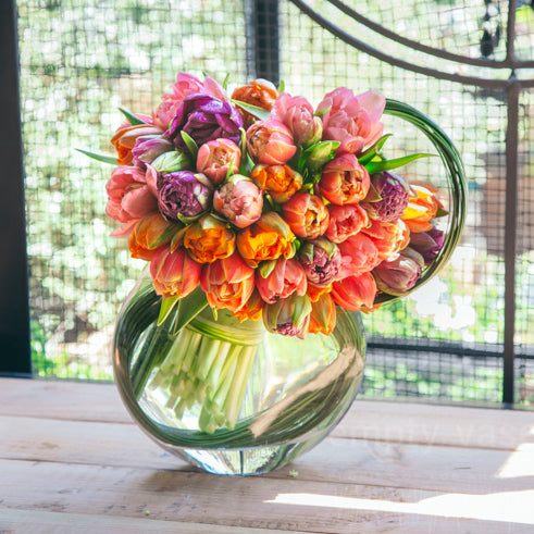 Front View Orange Juice Vase Pink Tulips Table Modern Kitchen Stock Photo  by ©EdZbarzhyvetsky 190380286