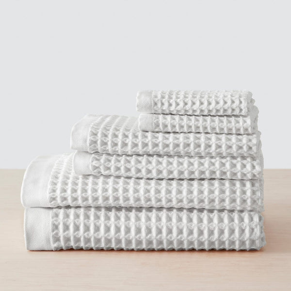 https://cdn.shopify.com/s/files/1/0438/1069/products/Imabari_Waffle_Towel_White_17_a3a40e53-a58d-4699-b123-dad3b5341f2b_600x600.jpg?v=1656118325