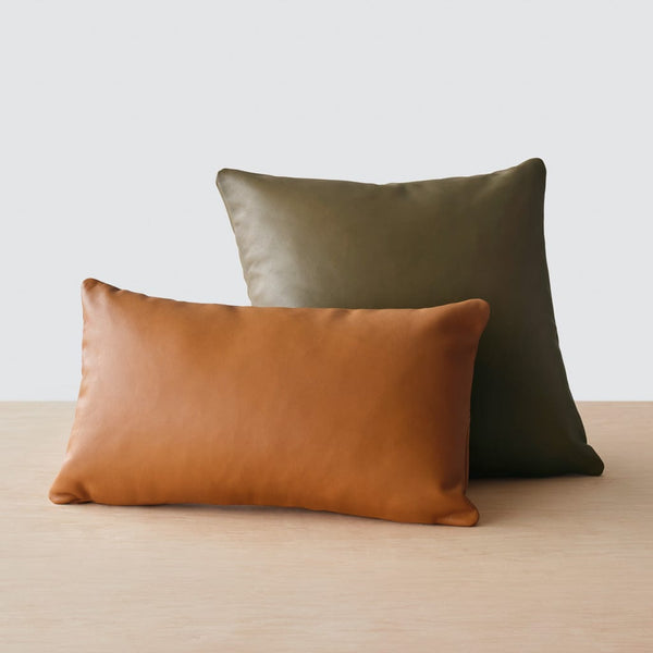 https://cdn.shopify.com/s/files/1/0438/1069/products/Torres_Leather_PIllow_Olive_5_600x600.jpg?v=1655203795