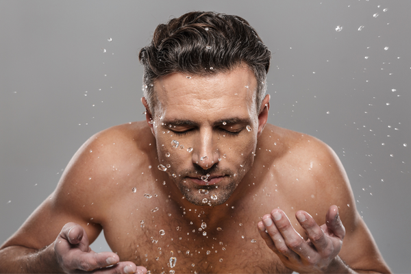 man washing face, splashing water on face, urth