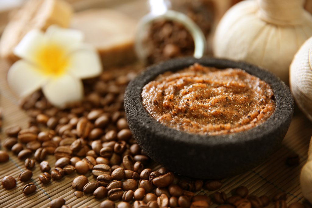 Coffee and sugar men's body scrub in a stone bowl, urth